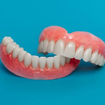How Are Partial Dentures Held in Place?